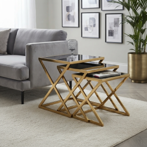 Ultra-Modern Set of 3 Gold Metal Nesting Coffee Tables with Black Glass Tops and Geometric X-Brace Frames