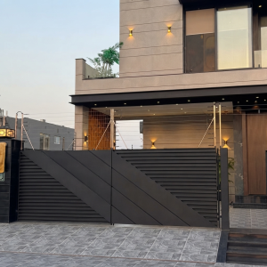 Ultra-Modern Matte Black Sliding Main Gate with Horizontal Privacy Slats and Striking Diagonal Geometric Overlay