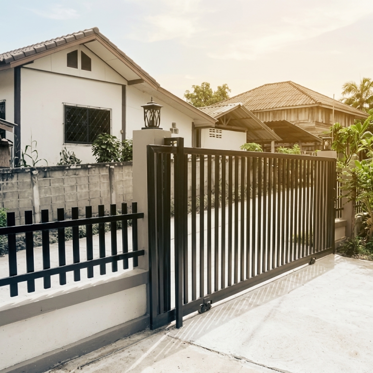 Ultra-Modern Matte Black Metal Sliding Main Gate with Vertical Slats and Minimalist Open Frame Design